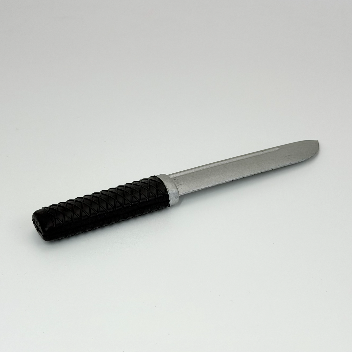 Rubber knife with silver blade