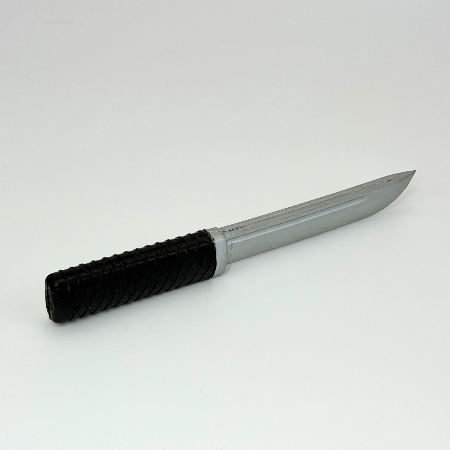 Rubber knife with silver blade