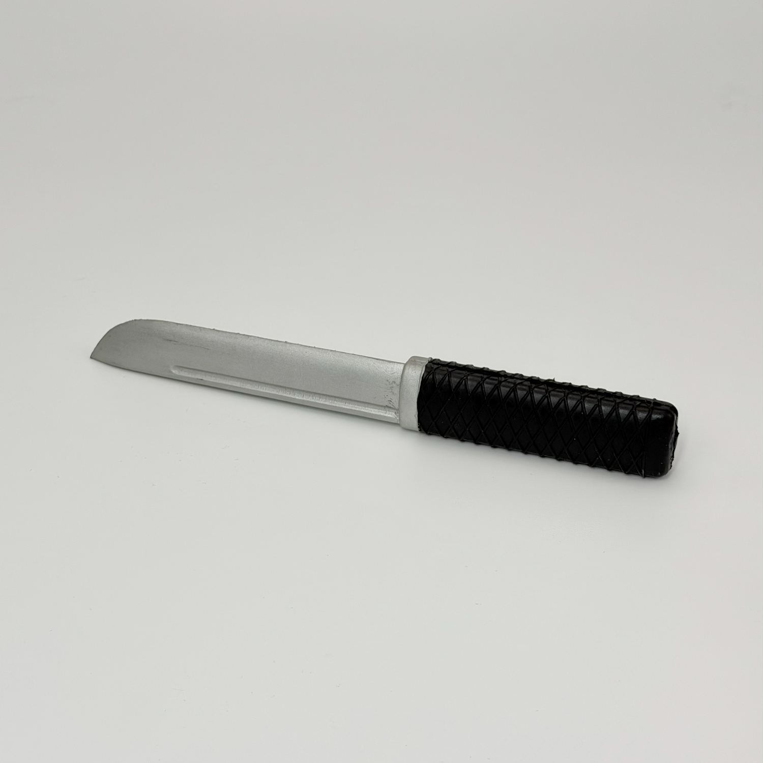 Rubber knife with silver blade
